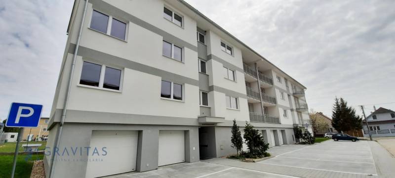 Apartment building on Školská Street in Chorvátsky Grob with parking spaces and garages.
