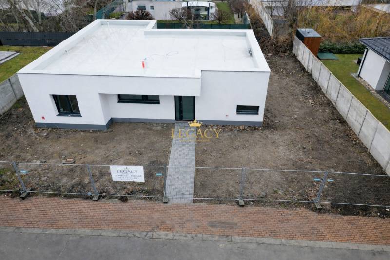 A family house on Sokolia Street in Chorvátsky Grob, surrounded by a garden and a fence.