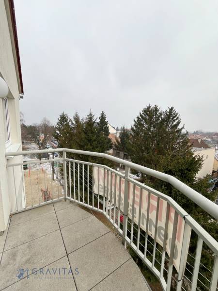 Balcony of a 3-room apartment on Školská Street in Chorvátsky Grob with a view of greenery.