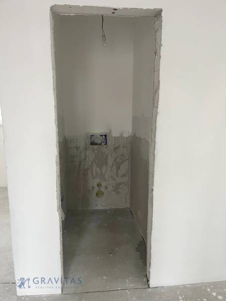 An unfinished room in a 3-room apartment prepared for equipment installation.