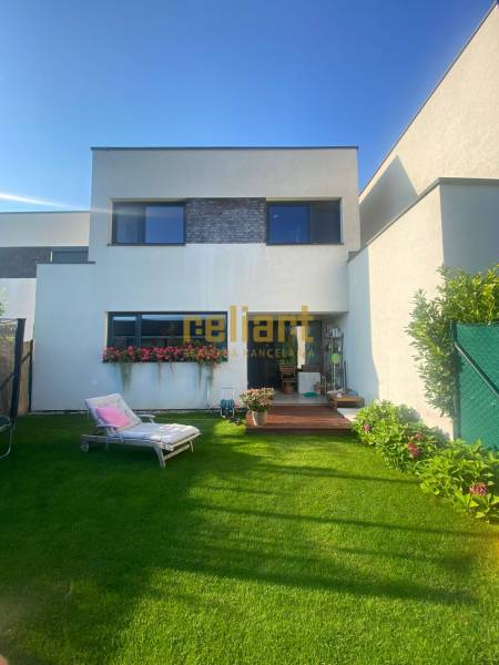 The family house on Radová Street in Nová Dedinka has a well-maintained garden with a lounger.