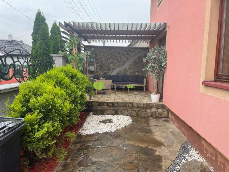 A family house on Strieborná Street in Košice, Barca district, with a landscaped terrace and greenery.