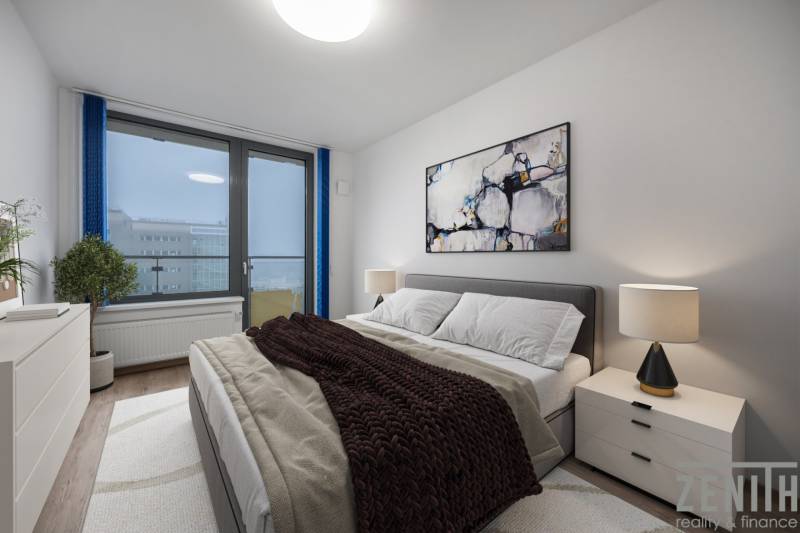 Bedroom in a 2-room apartment with a comfortable bed, a painting, and a lamp on the nightstand.