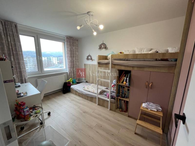 Children's room with a bunk bed in a 4-room apartment, floor with wooden decor.
