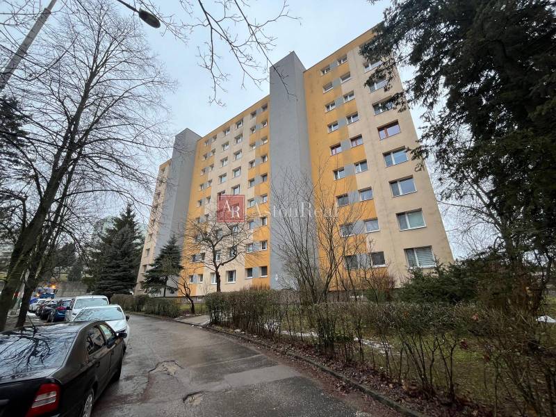 Apartment building on Chabenecká Street in Banská Bystrica with a parking lot and trees.