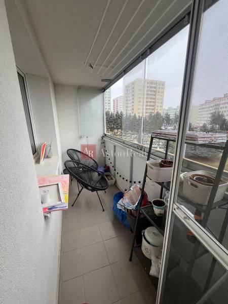 Glazed loggia with a view of the surroundings of a 4-room apartment in Banská Bystrica, Chabenecká Street.