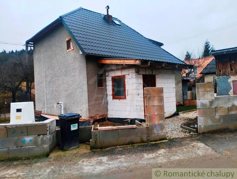 A family house in Jasenica with building materials and wooden decor.