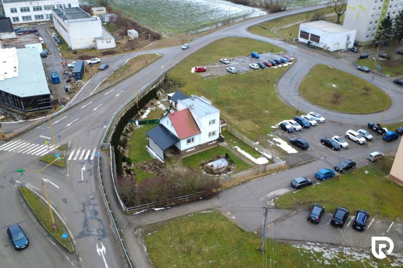 Family house on SNP Street in Považská Bystrica with an adjacent parking lot.