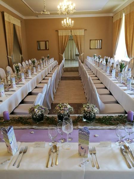 Banquet room in hotels and guesthouses with elegant dining and floral decorations.