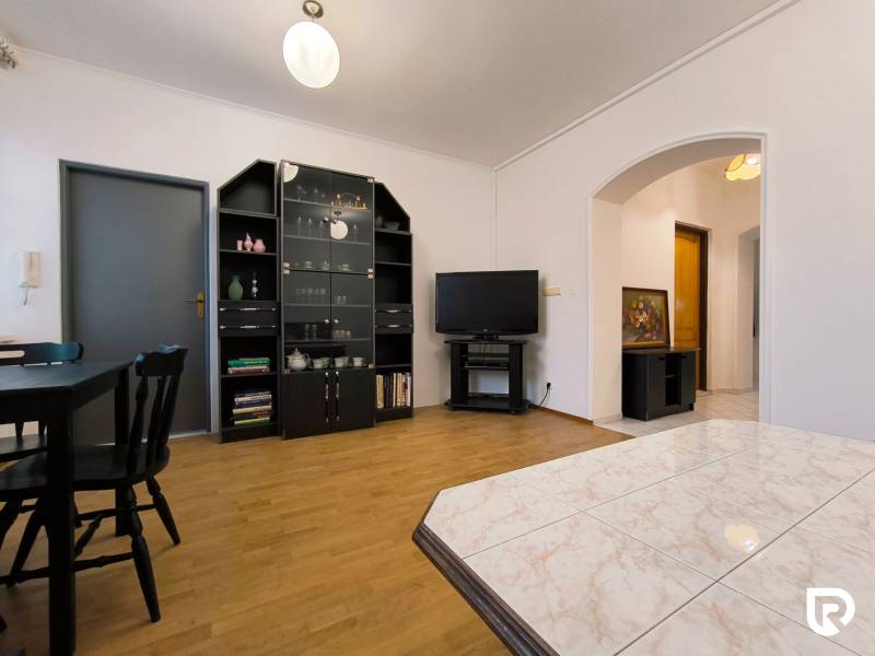 Living room in a family house with a wooden decor floor and modern furniture.