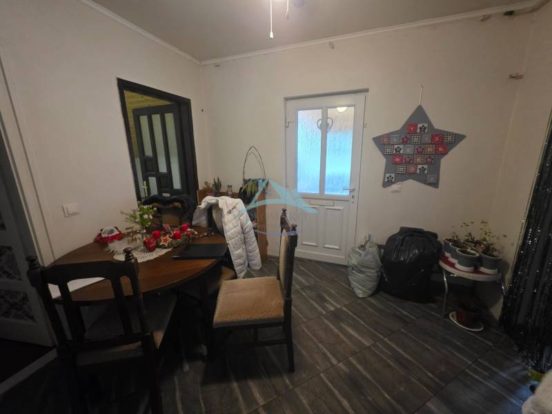 The interior of a family house with a table and decorations, wooden decor flooring.