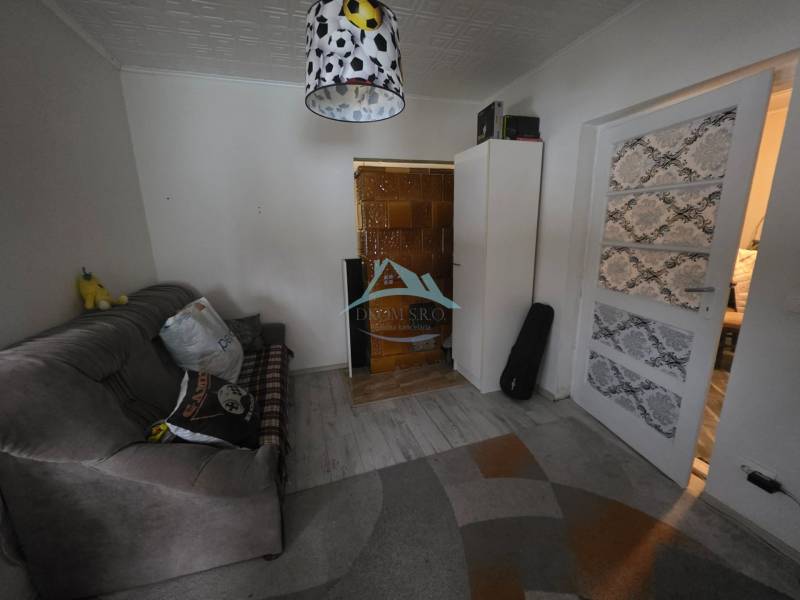 Living room in a family house with a comfortable sofa and decorative lighting.