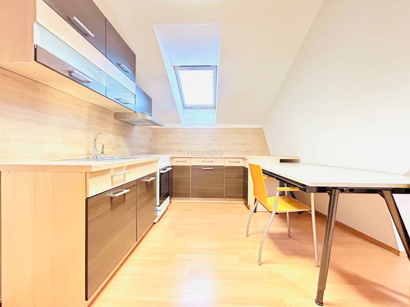 Offices with a kitchen and dining table, light floor with wood decor.