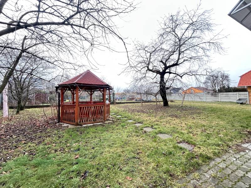 Garden with a gazebo and trees in Bratislava - Podunajské Biskupice on Komárovská near the offices.