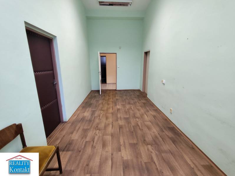 Offices with wood-patterned flooring, green walls, Nové Zámky.