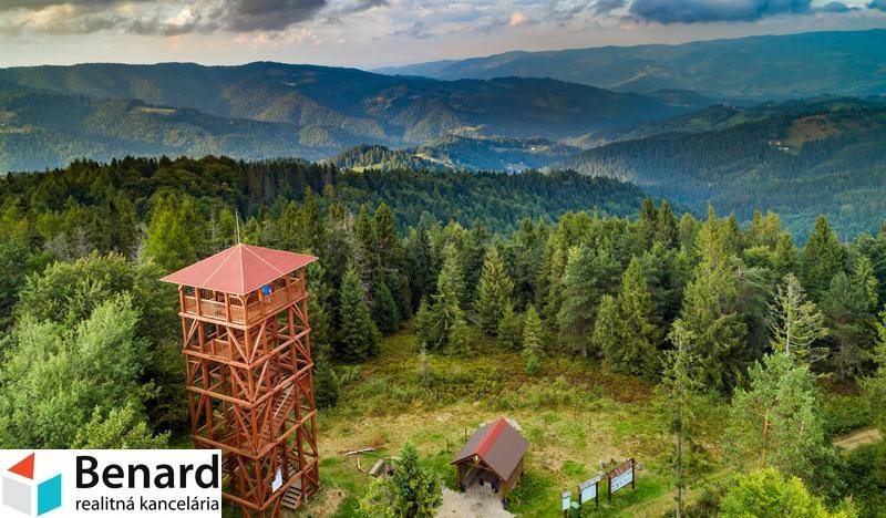 Observation tower on recreational grounds in Litmanová surrounded by dense forests and mountains.