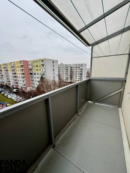 The balcony of a 3-room apartment on Hviezdoslavova Street with a view of the apartment blocks in Topoľčany.