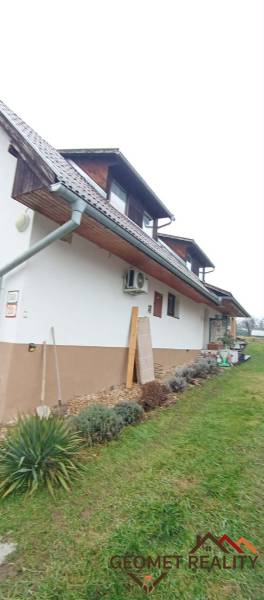 A family house on Cintorínska Street in Divín with a landscaped garden and an attic.