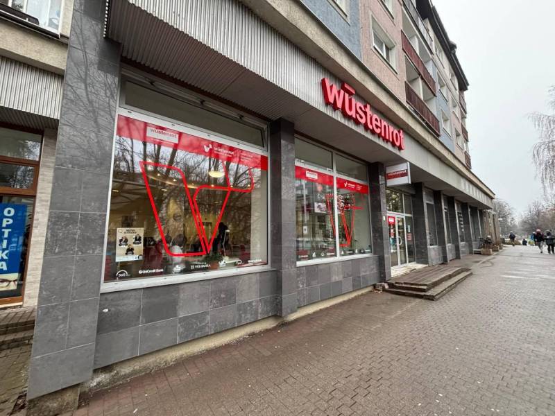 Commercial premises in Poprad with a prominent red logo on the building.