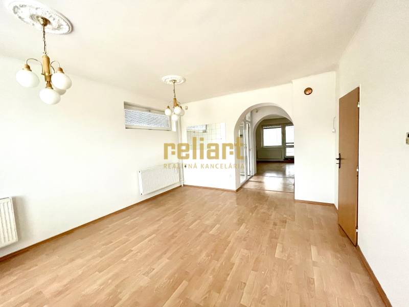 Interior of a family house with a wooden decor floor and decorative lighting.