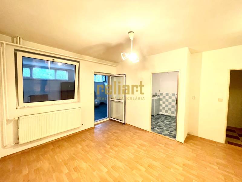 Interior of a family house with a wooden decor floor, view of the room and bathroom.