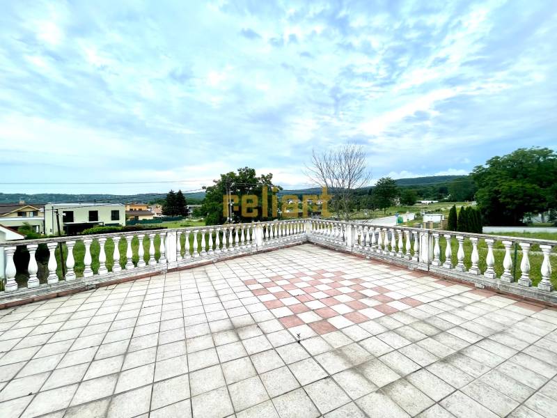 The terrace of a family house on Pútnická Street in Bratislava - Záhorská Bystrica with a view of greenery.
