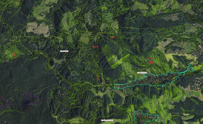 Aerial view of agricultural and forest lands around Malachov.