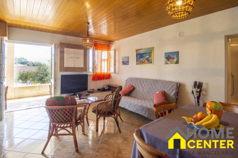 Recreational apartment with comfortable seating and a view from the terrace.