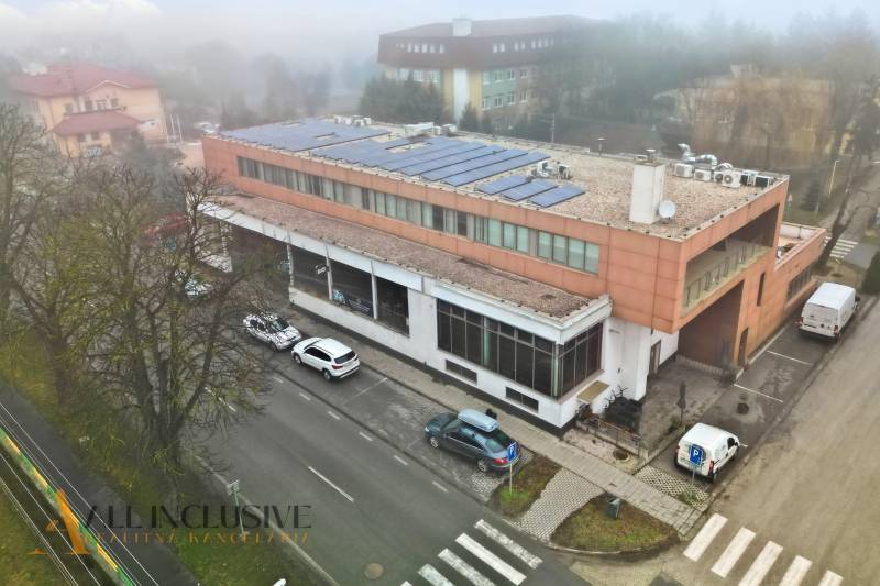 Commercial premises in Topoľníky with a solar roof, road, and parking lot.