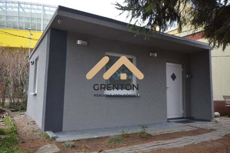 A cottage with a gray facade in Bratislava - Ružinov on Studená Street, surrounded by greenery.