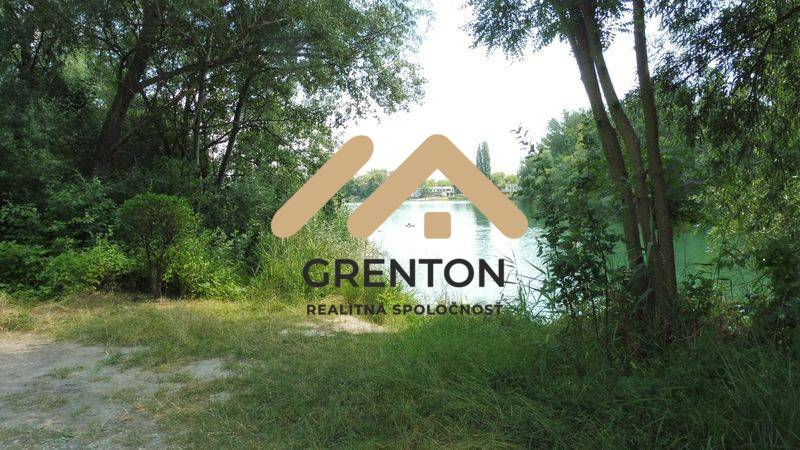 Nature by the water in Bratislava - Ružinov, Studená chata, surrounded by trees and greenery.