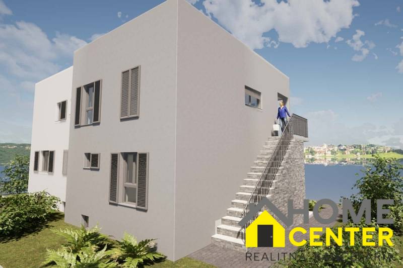 The exterior of a holiday apartment in Čiovo with a view of the sea and the surrounding landscape.