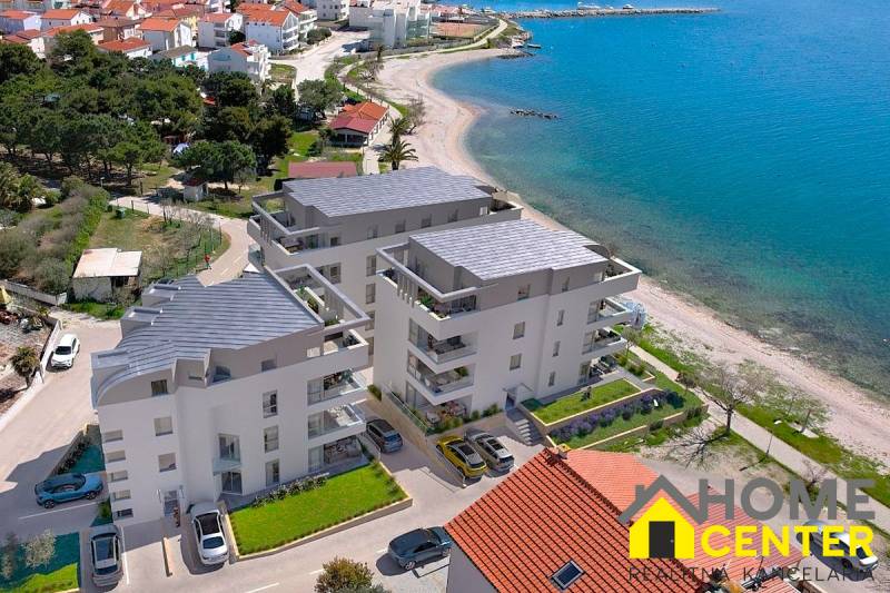 Apartment in Pag near the beach, with a view of the sea and surrounding landscape.