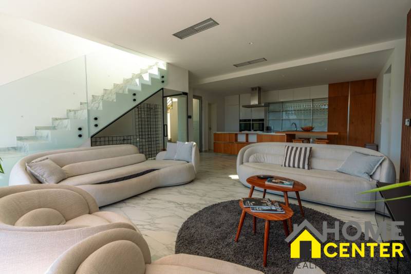 A bright interior of the villa with a spacious living room, modern kitchen, and comfortable furniture.