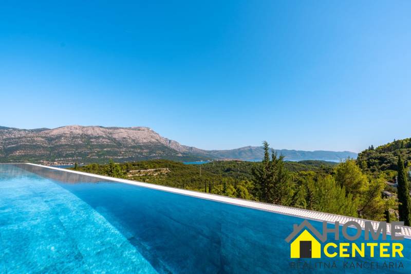 View from the villa in Korčula of the pool and mountains in the distance.