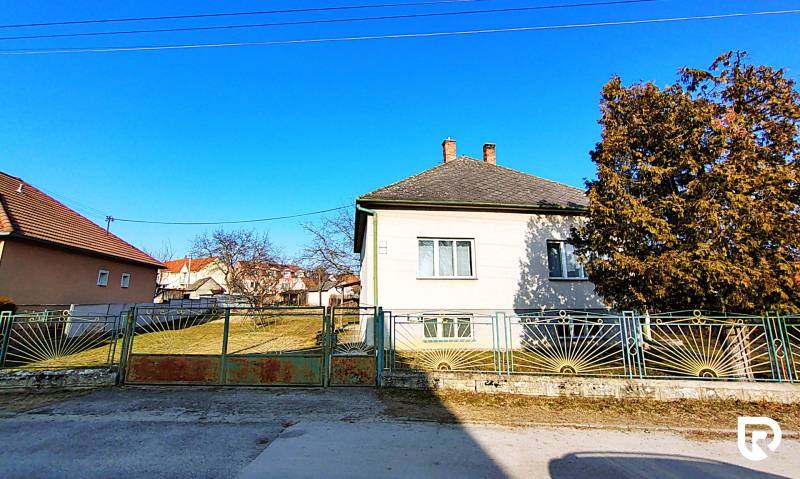 A family house on Sadová Street in Borský Mikuláš, with two chimneys and an extensive yard.