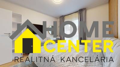 Bedroom in a 2-room apartment with a TV and a wooden decor floor.