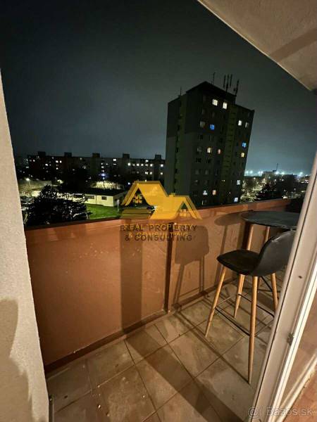 A night view from the balcony of a 2-room apartment in Nové Zámky onto the street Nové Zámky.