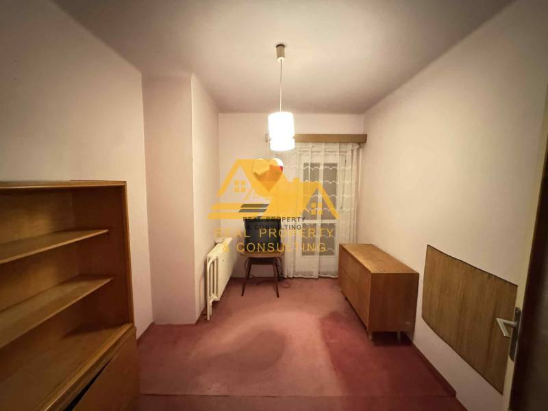 A room in a family house with furniture and curtains, without a floor with a wooden decor.