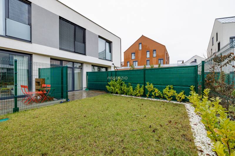 The exterior of a 2-room apartment on Jaspisova Street in Jarovce with a terrace and lawn.
