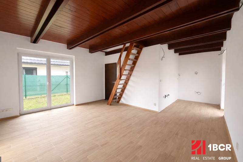 Interior of a family house with a ladder staircase and a wooden decor floor.