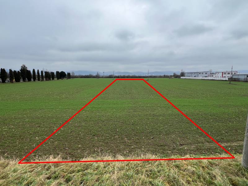 Commercial land for sale in Pruské, highlighted plot on a vast green area.