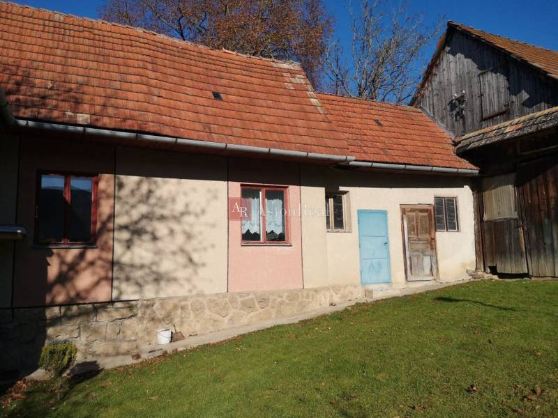 A family house on Kalameny Street in Ružomberok with a red roof and a simple facade.