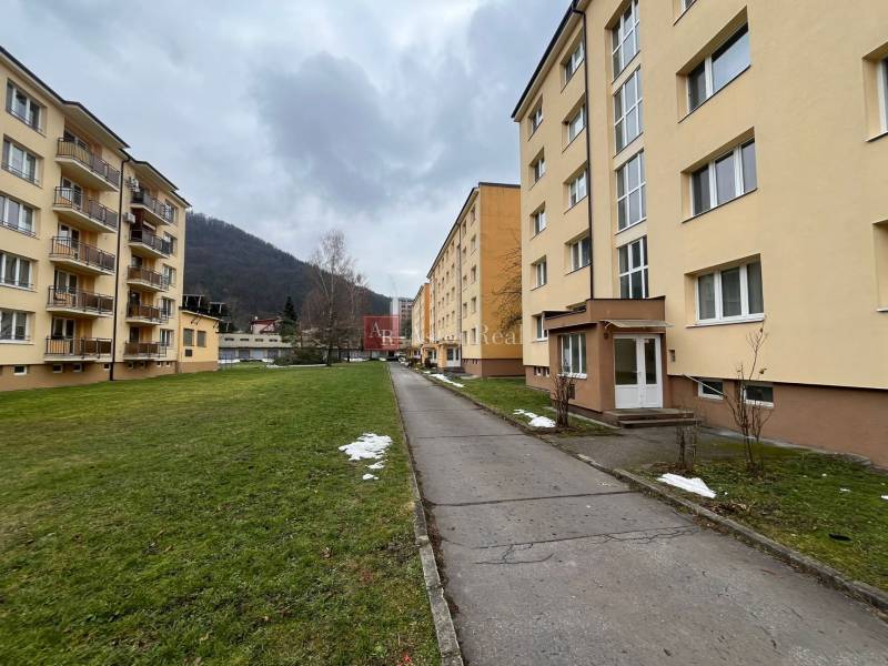 Apartment building on Golianova Street in Banská Bystrica surrounded by a grassy area.