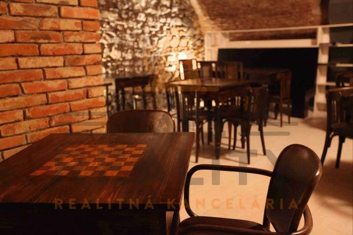 Rustic gastro spaces with stone walls and wooden decor flooring.