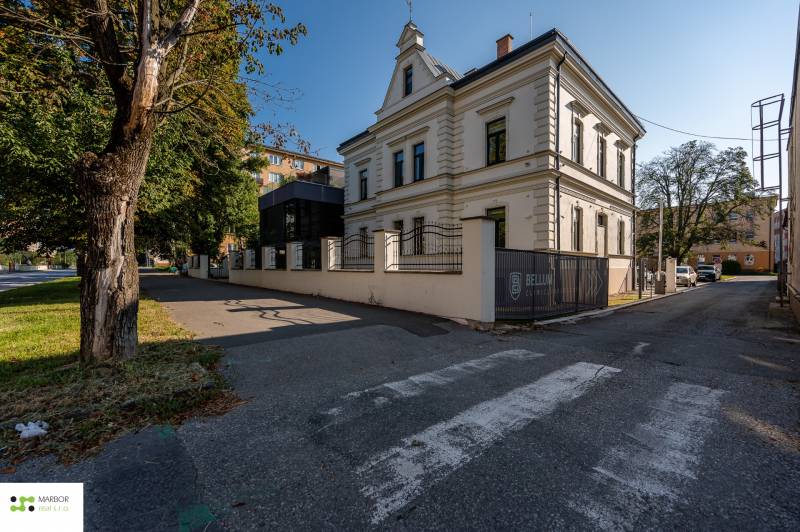 A historical building with a modern extension and greenery on Južná trieda, Juh district, Košice.