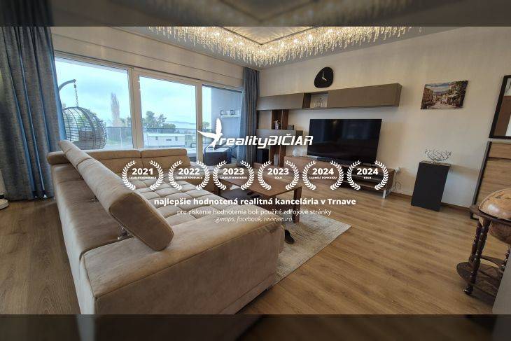 Living room in a Holiday Apartment with a sofa and wooden decor flooring.