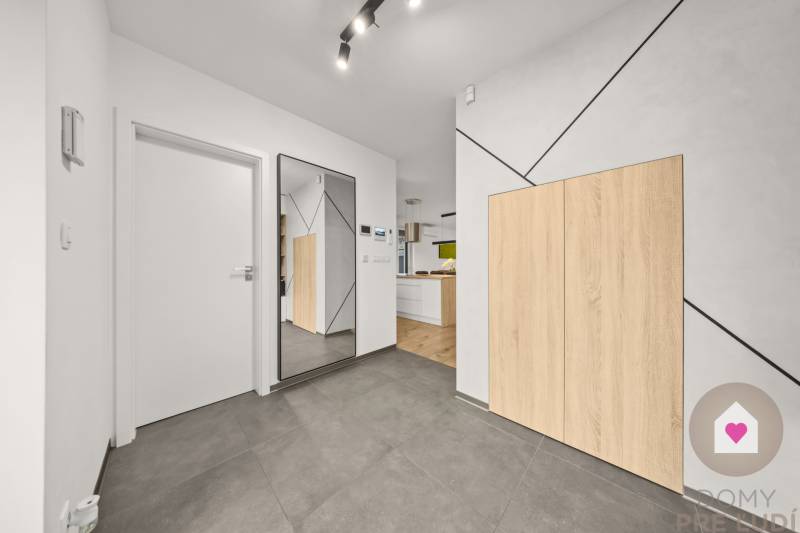 Interior of a 4-room apartment with tiled flooring and wood-patterned flooring.