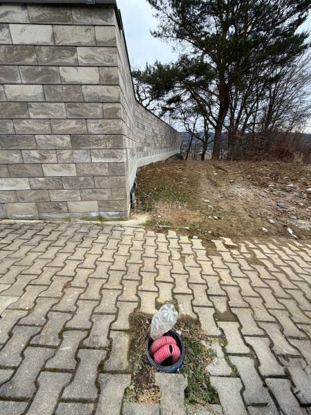 A brick fence and concrete paving on residential plots in Veľká Bytča.
