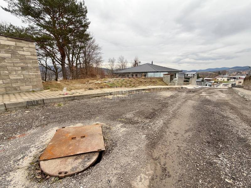Plots - housing in Veľká Bytča, Bytča, with a view of the surroundings and trees.